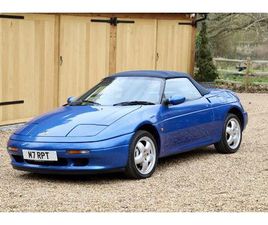 LOTUS ELAN M100 S2, 1995. PACIFIC BLUE METALLIC WITH FULL DARK BLUE LEATHER INTERIOR AND MATCHING BLUE SOFT-TOP.