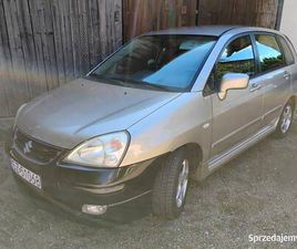 SUZUKI LIANA SUZUKI LIANA 1.6 GAZ, HAK, GRZANE FOTELE, RADIO ANDROID, KAMERA COFANIA GDÓW - SPRZEDAJEMY.PL