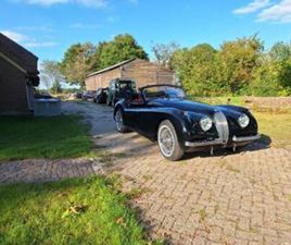 ② JAGUAR XK120 DHC CABRIO (1953) ZWART ROOD LEDER NIEUWSTAAT! — JAGUAR — 2EMEMAIN