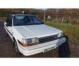 TOYOTA CARINA 1987 TOYOTA CARINA BLANC MANUEL, 5 VITESSES CONDUITE À DR...