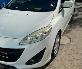 ICH VERKAUFE EINEN MAZDA 1,6 DIESEL MIT 7 SITZEN.