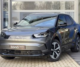 FORD CAPRI - STYLE STANDARD RANGE RWD 52 KWH | ALL-WEATHER BANDEN | MASSAGESTOEL | DRAADLOZE TELEFOONLA