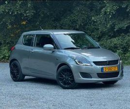 SUZUKI SWIFT 1.2 3-D 2013 GRIJS — SUZUKI — MARKTPLAATS