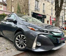 TOYOTA PRIUS HYBRIDE RECHARGEABLE MC19 1.8 VVT-I 122 CV DYNAMIC PACK PREMIUM / SYSTÈME AUDIO JBL / AFFICHAGE TÊTE HAUTE / SIÈGES CHAUFFANTS