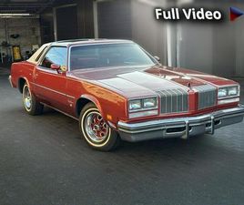 OLDSMOBILE CUTLASS OLDSMOBILE CUTLASS SUPREME 1977 – ROCKET 350 V8 T-TOPS CZERWONE WNĘTRZE SULECHÓW