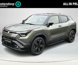 SUZUKI E-VITARA SUZUKI E VITARA STYLE 61 KWH **NIEUWE BI-TONE KLEUR LAND BREEZE/ BLUISH BLACK/ PANORAMA/ NIEUWE AUTO**