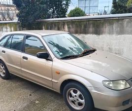 MAZDA 323F DANS L'ÉTAT