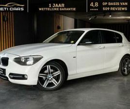 BMW SERIE 1 118 ② BMW 118 AUT. SPORT LINE | NAVI | SENSOREN | TREKHAAK | — BMW — 2EMEMAIN