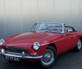 MG MG B ROADSTER TARTAN RED BJR 1963 94 PK LINKS GESTUURD! | WIRE WHEELS | PULL-HANDLE DEUREN | LUGGAGE RACK | CHROMEN BUMPERS | ZEER NETTE CONDITIE