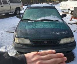 SUZUKI ESTEEM 98 (REQUIRES SOME WORK, R AND D)