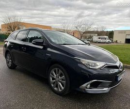 TOYOTA AURIS TOURING SPORTS TOYOTA AURIS TOURING-SPORTS 1.8 HSD 136H 100 FULL-HYBRID TOIT PANORAMIQUE / EQUIPÉ ETHANOL
