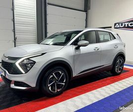 KIA SPORTAGE V 1,6 T-GDI 230CH ISG HYBRIDE ACTIVE BVA 6 / DE 2024 / PREMIERE MAIN / GARANTIE CONSTRUCTEUR JUSQU’AU 01/2031 / CARPLAY / CAMERA / DISPONIBLE DE SU