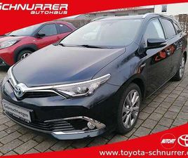 TOURING SPORT 1,8-L-HYBRID EXECUTIVE