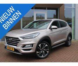HYUNDAI TUCSON - 1.6 T-GDI 177PK PREMIUM AUTOMAAT LEER AIRCO NAVI CAMERA TREKHAAK VOL DEALER ONDERHOUDEN
