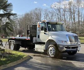 USED 2017 INTERNATIONAL 4300 CUMMINS HOOK LIFT 16-FOOT ROLL-OFF FLAT DECK TRUCK