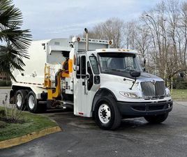 USED 2017 INTERNATIONAL WORKSTAR 7400 TANDEM SIDE LOAD DIESEL GARBAGE TRUCK