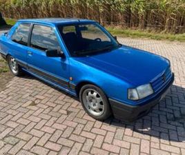 PEUGEOT 309 GTI PEUGEOT 309 GTI 1.9 16V MIAMI BLUE 160 PK MET NAP MI16 — PEUGEOT — MARKTPLAATS