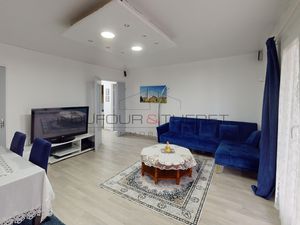 Vaste appartement avec balcon  cave et place de parking à ve