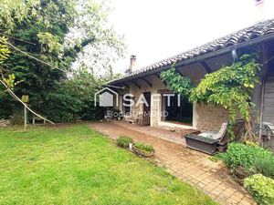 Ensemble immobilier comprenant deux maisons mitoyennes totalisant une surface habitable de