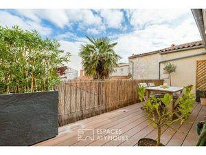 Appartement avec terrasse et finitions soignées proche du marché