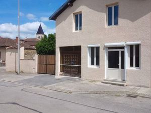 Bien immobilier comprenant local commercial  appartement et terrain