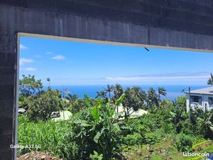 Vends terrain avec maison à finir