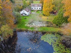 Havre de paix avec cette maison et son magnifique étang poissonneux