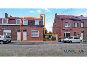 Maison 3 façades avec passage latéral