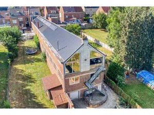 Bâtiment polyvalent avec habitation et atelier