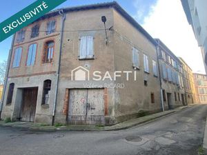 Immeuble d'habitation avec garages  à réhabiliter ouvert sur 4 rues  face aux berges du Ta