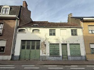 Remise avec potentiel de développement au cœur de Merchtem