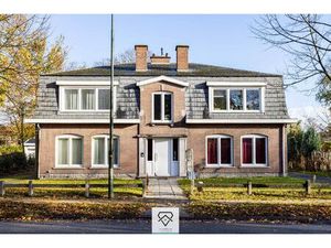 Opbrengsteigendom met 4 appartementen en 2 dubbele garageboxen te koop