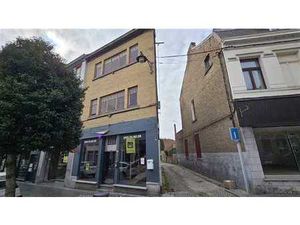 Immeuble mixte (commerce + permis pour 1 appartement)
