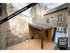 Immeuble avec local commercial dans le centre