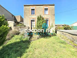 Maison à rénover avec garage et jardin en plein coeur du bour