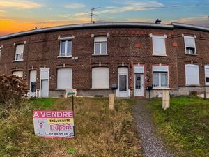 Jolie maison mitoyenne avec véranda  jardin et grand garage à
