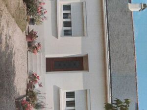 Maison rdc avec beau jardin proche commerces  transports  universités