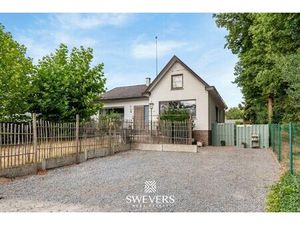 Gezinswoning met vier slaapkamers op ruim perceel in groene omgeving van Heusden-Zolder