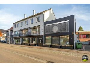 Handelshuis met absolute topligging en verhuurd bovenliggend appartement in hartje Alken.