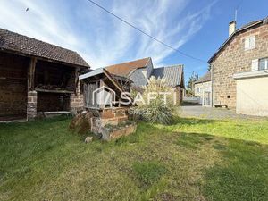 Maison en brasier rénovée avec dépendances et terrain.