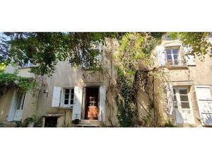 Maison atypique avec parcelles agricoles