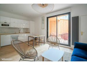 T2bis meuble rdc avec terrasse petit immeuble pierre