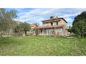 Maison divisée en 2 appartements indépendants+ terrain const