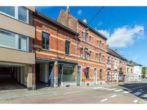 Immeuble de rapport avec 3 unités (magasin + 2 appartements)