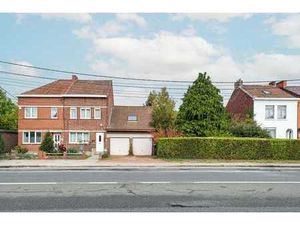 Maison 3 façades avec garage double  grand jardin et passage