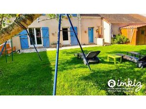 Maison familiale spacieuse avec garage et jardin