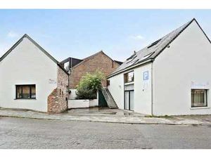 Immeuble de rapport avec espace commercial et duplex