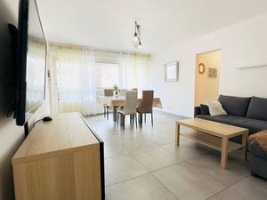 Appartement rénové avec balcon et garage