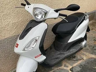 scooter blanc peu de km, expertisé