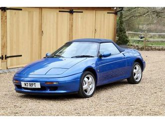 lotus elan m100 s2, 1995. pacific blue metallic with full dark blue leather interior and matching blue soft-top.